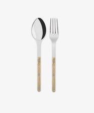 The Bistrot Serving Set features a stainless steel spoon and fork with light brown, floral-patterned handles, evoking French flair. They are displayed side by side on a white background.