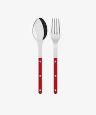 The Bistrot Serving Set, featuring a stainless steel spoon and fork with red handles and silver rivets in Parisian bistro style, is arranged side by side on a white background.