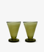 Set of six Elodie Footed Wine Glasses, green handblown with wide bases and slightly flared rims, displayed side by side on a white background.