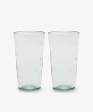 Six clear, slightly textured Elodie Water Glasses are placed side by side on a white background.