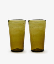 A set of six Elodie Water Glasses, made from transparent yellow-green recycled glass, are displayed side by side against a plain white background.