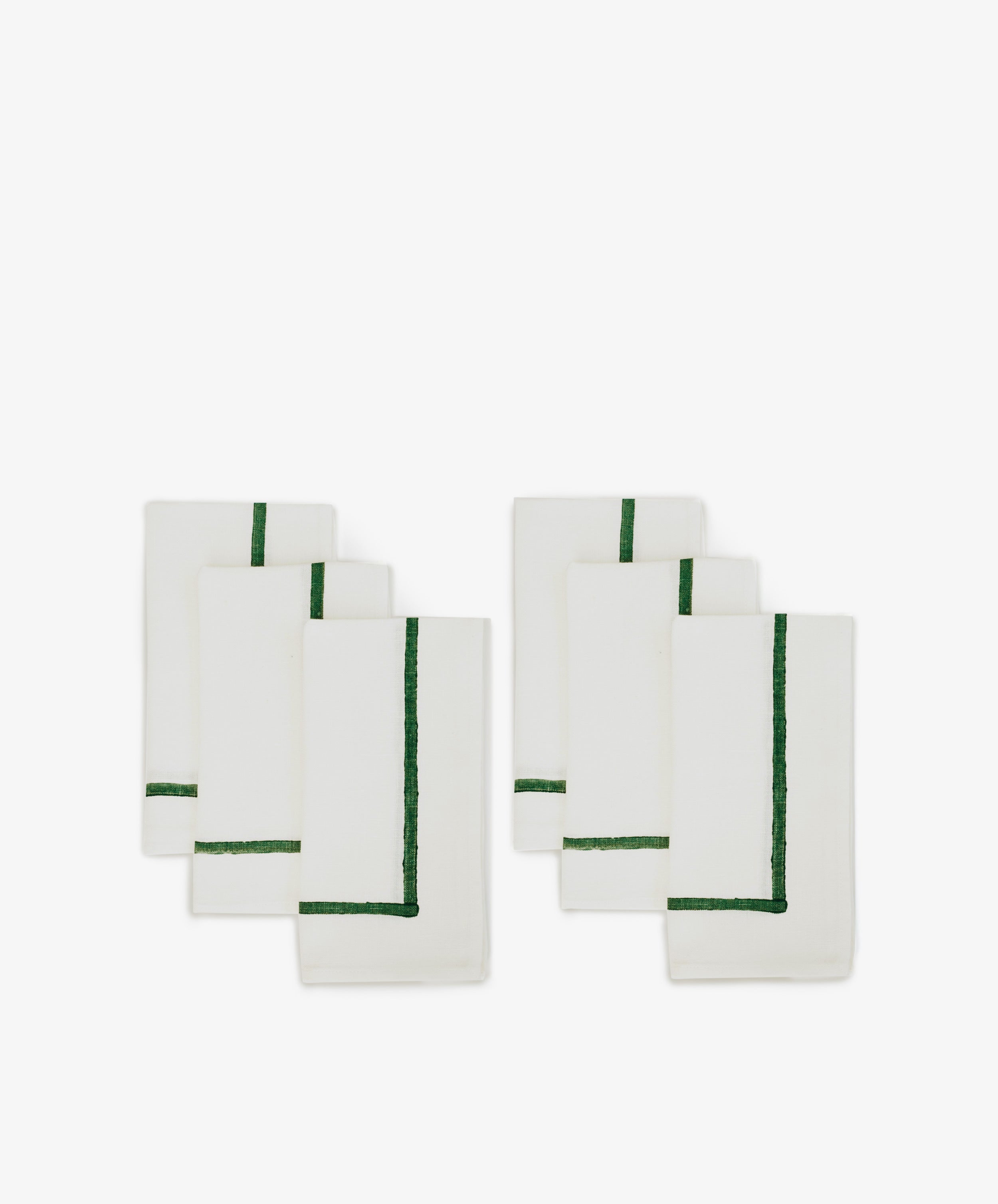 A set of six Riga Napkins, each white with a single green border stripe, displayed in two rows of three on a plain white background.
