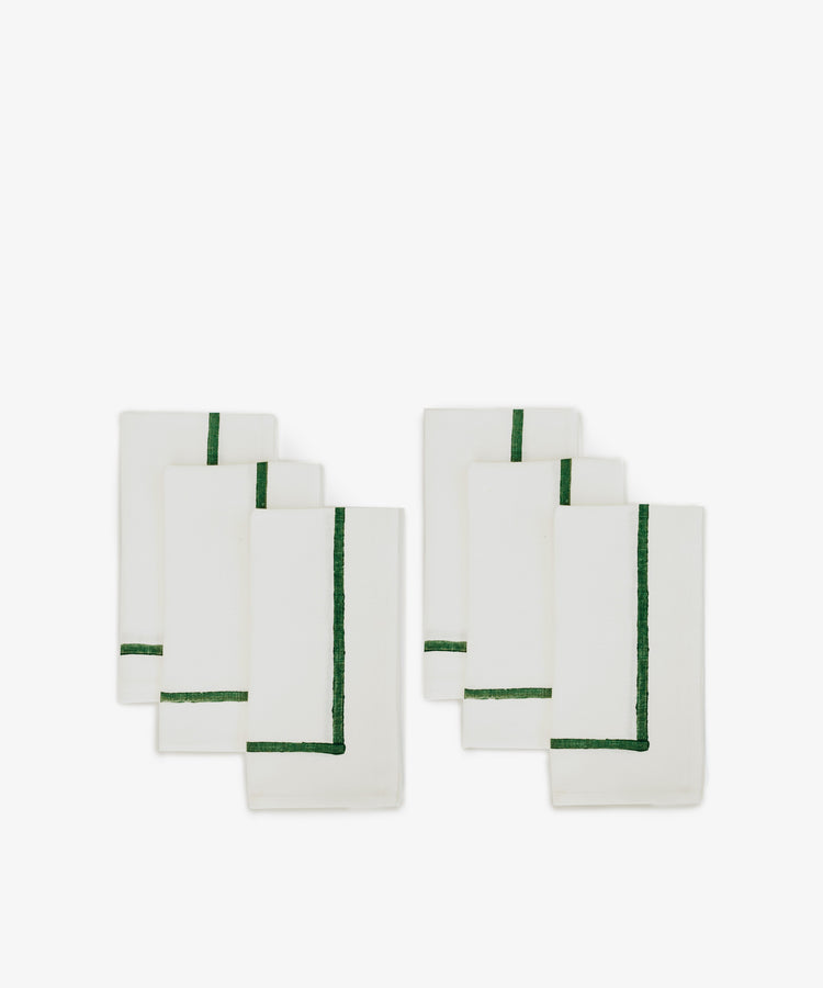 A set of six Riga Napkins, each white with a single green border stripe, displayed in two rows of three on a plain white background.