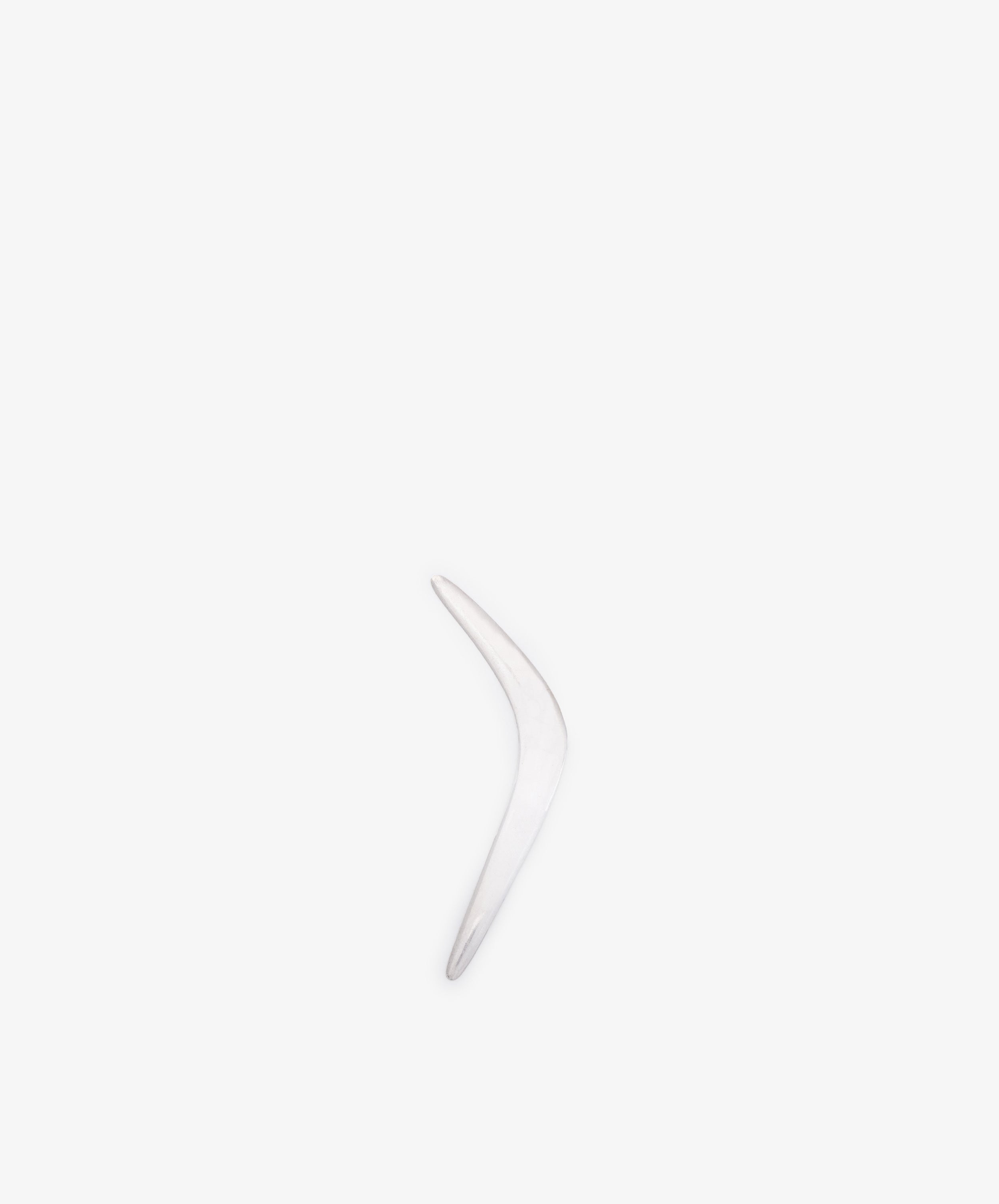 The Vintage Silver Boomerang Letter Opener, a single curved metallic piece, stands vertically against a plain white background.