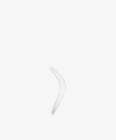 The Vintage Silver Boomerang Letter Opener, a single curved metallic piece, stands vertically against a plain white background.