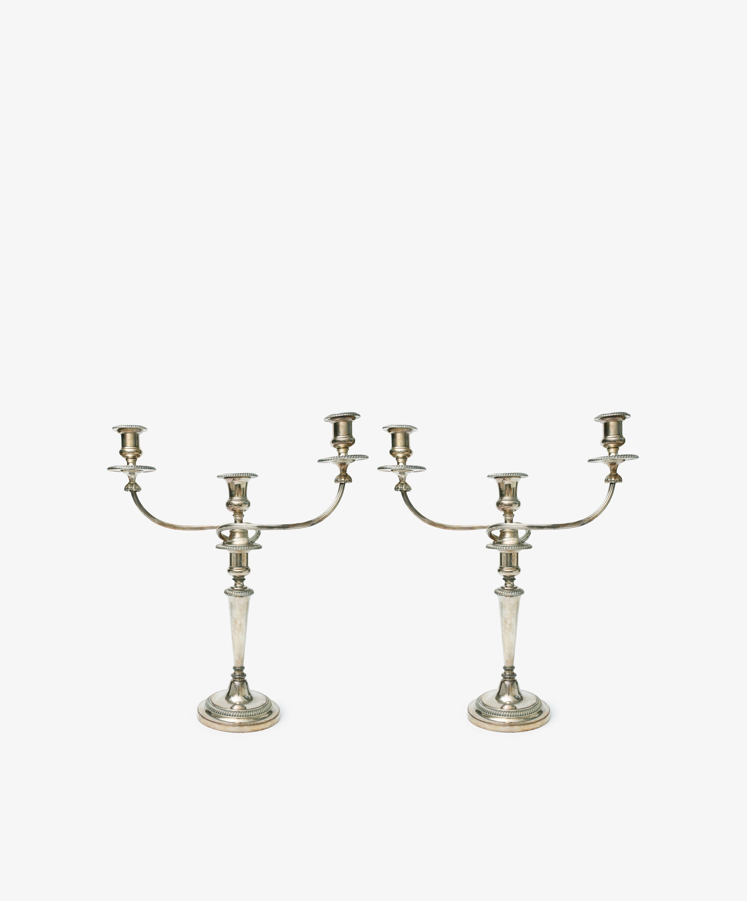 A set of 2 Vintage Silver-Plated Sheffield Plate Candelabra, each with a central stem and two curved arms in classic Georgian style, displayed on a plain white background.
