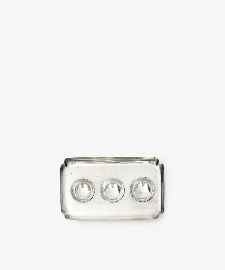 A Vintage Silver Inkstand Base with a rectangular clear glass tray featuring three circular indentations, inspired by vintage collections, displayed on a plain white background.