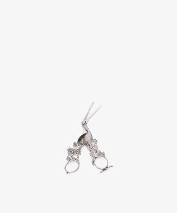 A pair of Vintage Dutch Silver Ribbon Nips, shaped like a stork with detailed floral designs on the handles, displayed on a white background.