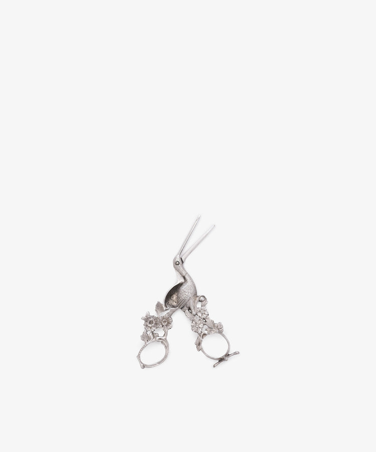 A pair of Vintage Dutch Silver Ribbon Nips, shaped like a stork with detailed floral designs on the handles, displayed on a white background.