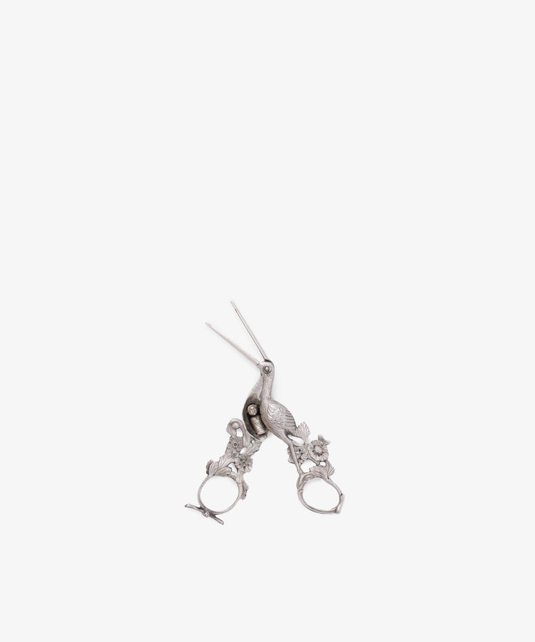 The Vintage Dutch Silver Ribbon Nips are ornate, silver-colored scissors inspired by vintage sewing tools, with intricate handle details, displayed on a white background.