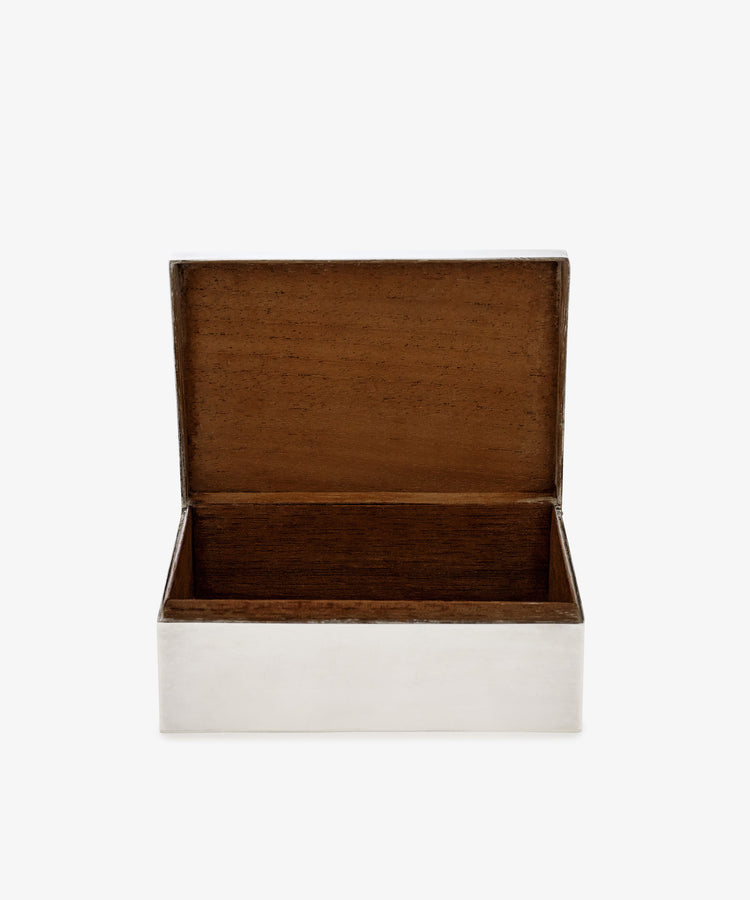 The Vintage Scottish Silver Box features a rectangular shape with a hinged lid, opening to reveal an empty wood-lined interior. Its sleek silver exterior adds an elegant touch to this classic decorative piece.
