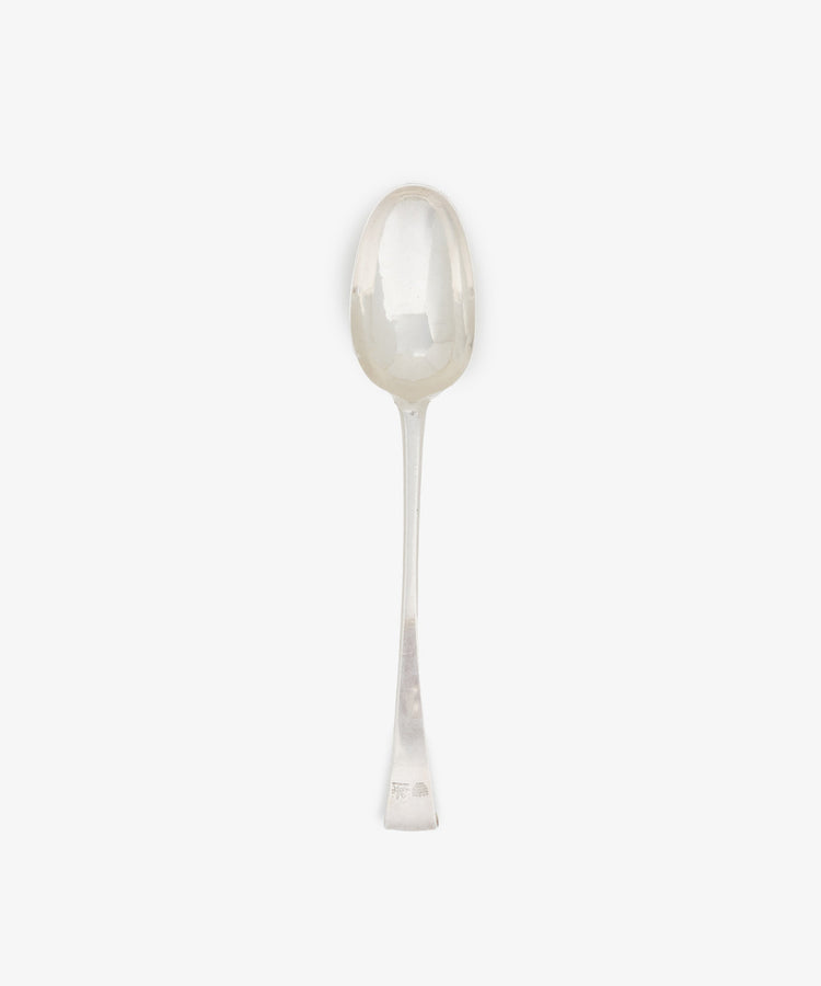 A Vintage Irish Silver Basting Spoon with a rounded bowl and straight handle is displayed on a plain white background.