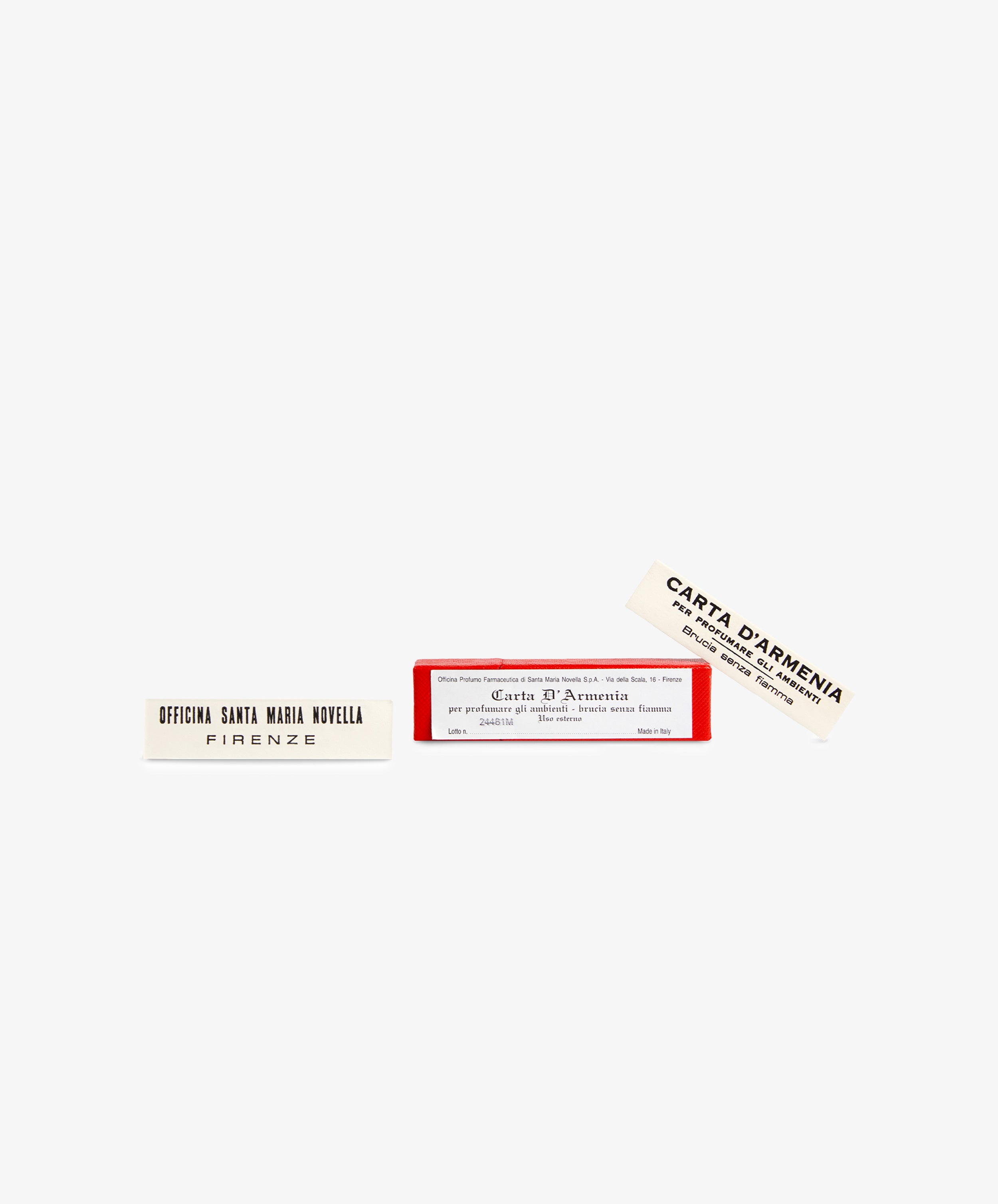 A rectangular red box labeled Armenia Paper - Small Box contains two white perfumed slips, one reading Officina Santa Maria Novella Firenze and the other Carta D’Armenia, both known for their distinctive resinous scent.