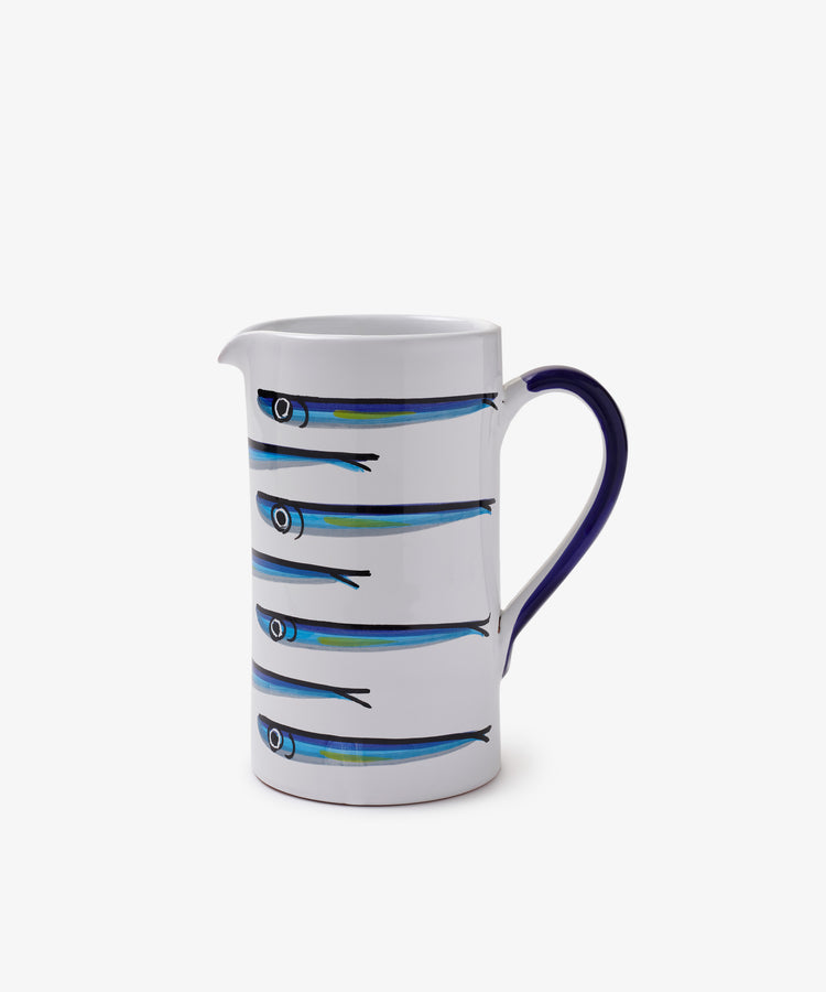 The Tommaso Jug is a white ceramic pitcher with a blue handle, featuring four stylized blue sardines in a horizontal row—bringing the charm of the Amalfi Coast to your table.