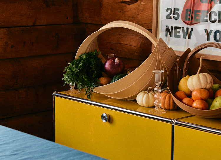 wood baskets with vegetables on yellow table