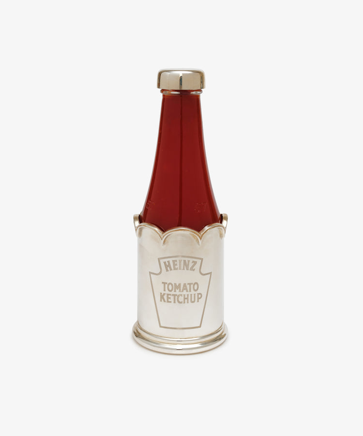 Sterling Silver Ketchup Sleeve & Lid. Glass ketchup bottle with sterling silver lid and engraved 'Heinz' sleeve.