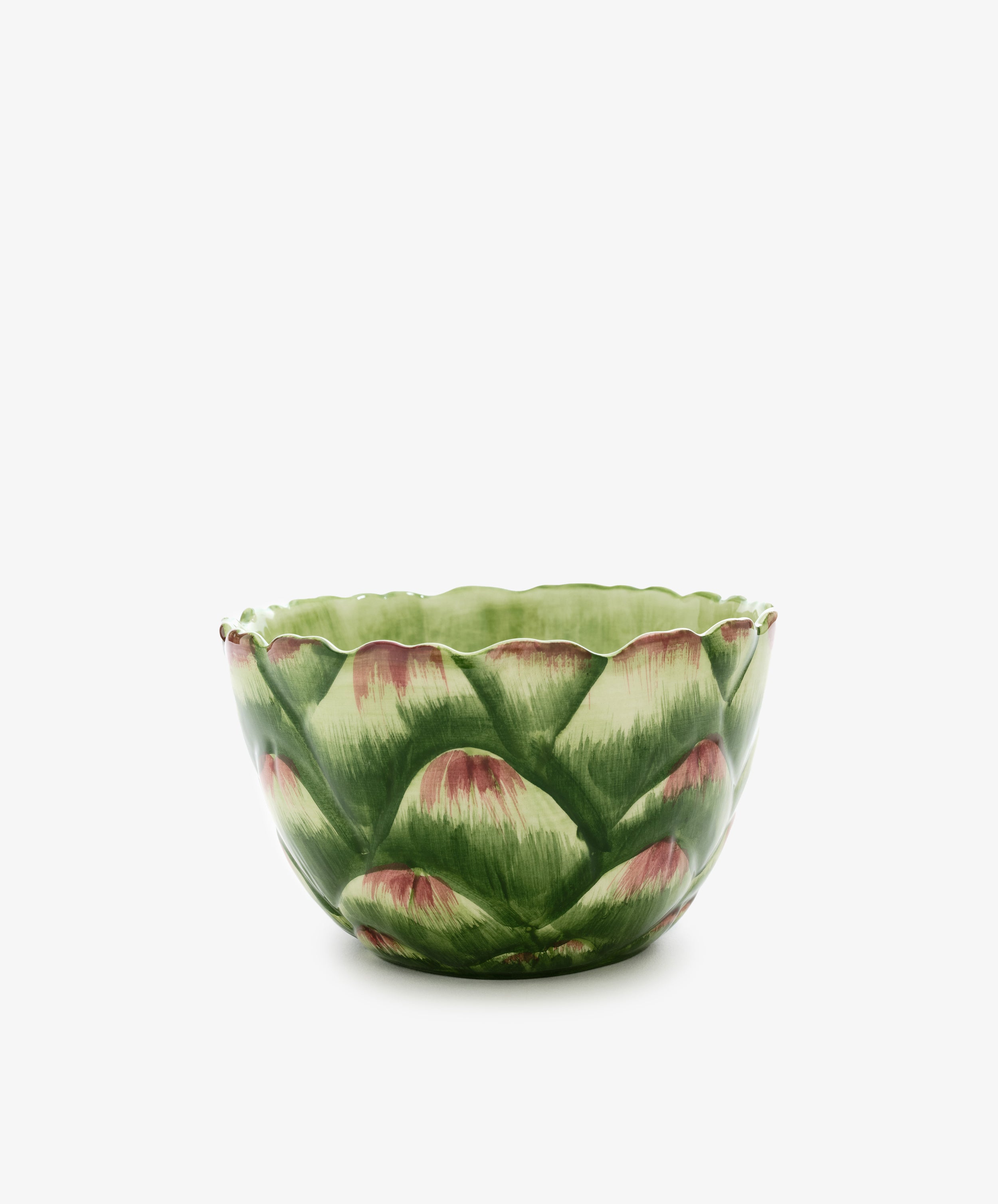 Artichoke bowl. Hand-painted green earthenware bowl that resembles the petals of an artichoke. Side view.