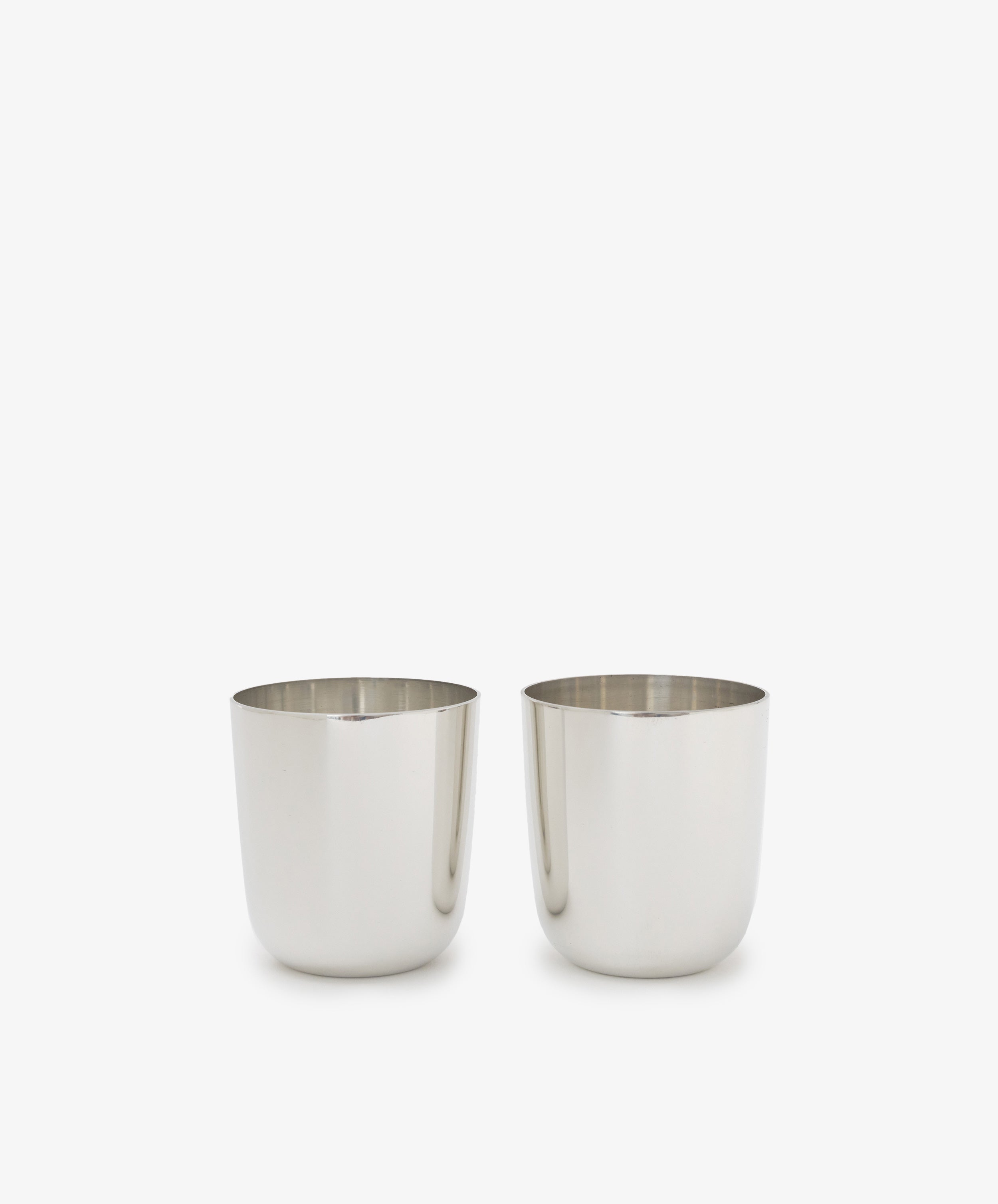 The Alexander Stemless Tumbler Set of 2, crafted from stainless steel, sits side by side on a plain white background, exuding modern sophistication.