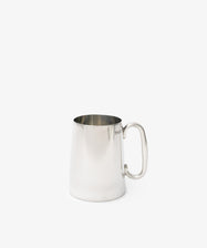 The Harry Tankard—a sleek, polished silver metal mug with handle—offers contemporary drinkware style, ideal for modern settings.