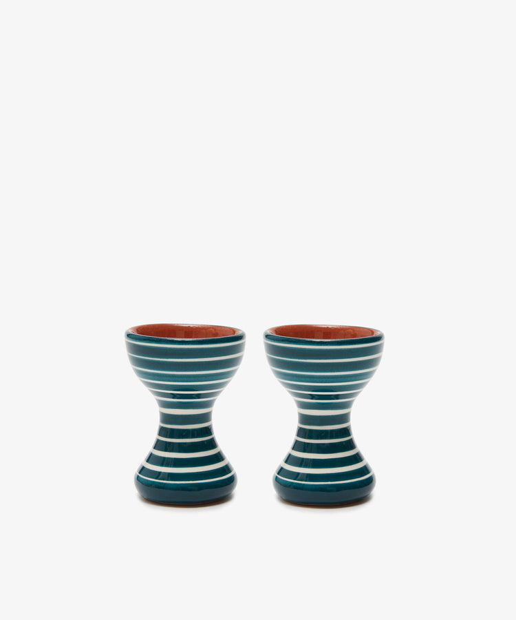 The Natalia Egg Cup, Set of 2, features blue and white striped ceramic cups placed side by side on a plain white background—perfect for enjoying eggs and soldiers with the ideal dip.