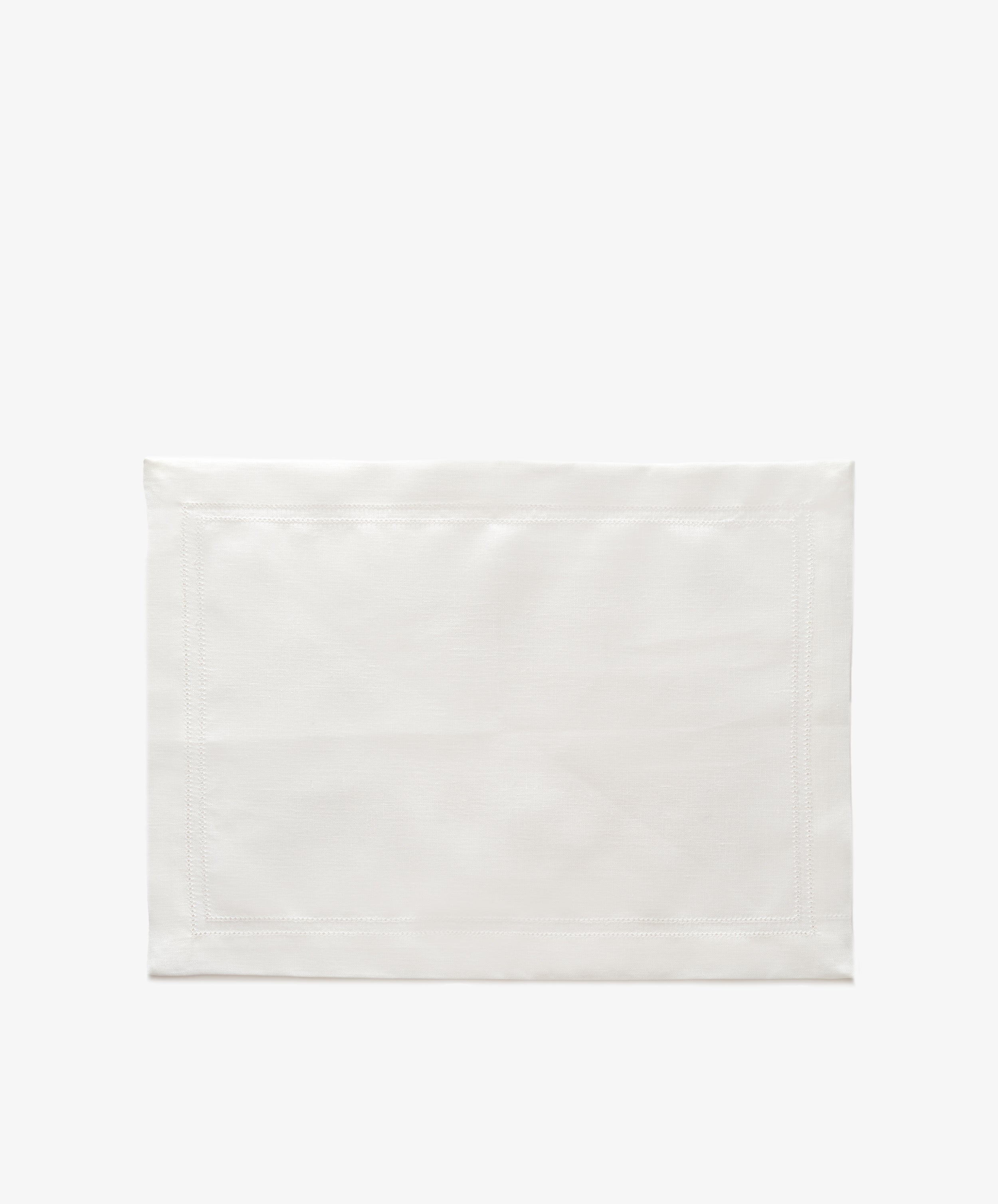 Lorna Hemstitch Placemat. Rectangular mat in white linen with ivory stitching.
