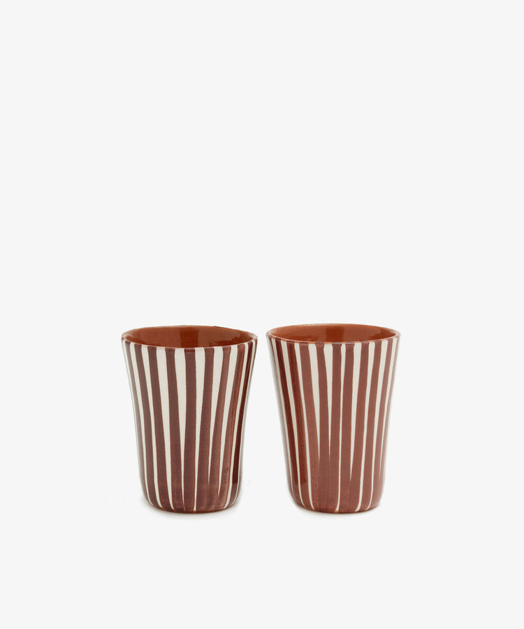 Two chic, handmade Natalia Espresso Cups (set of 2) featuring vertical white and brown stripes are displayed side by side against a plain white background.