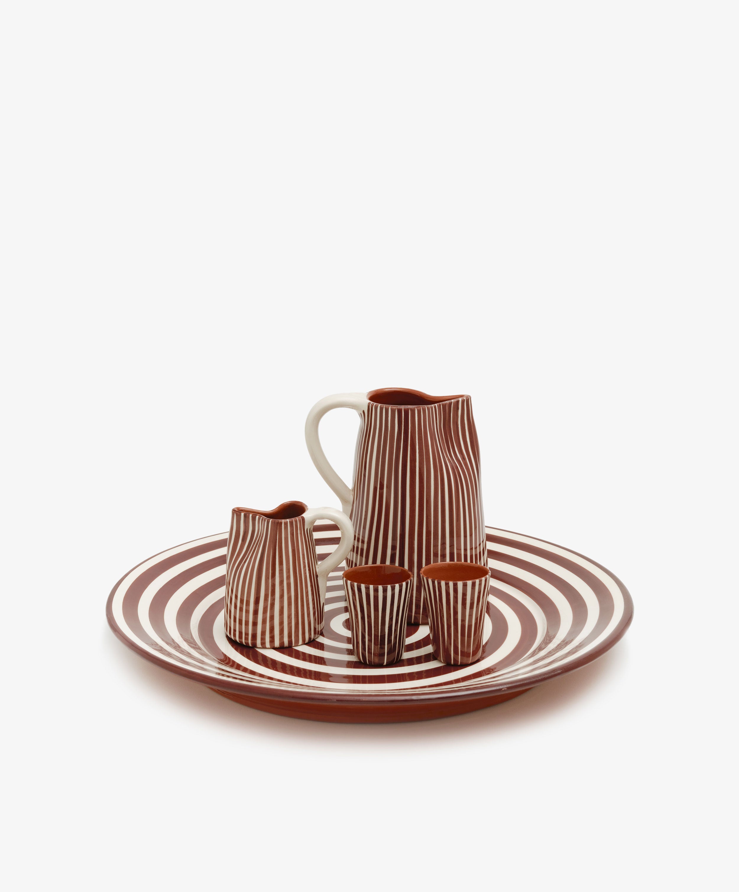 Natalia Platter in burgundy and white holds matching tumblers, milk jug and pitcher.