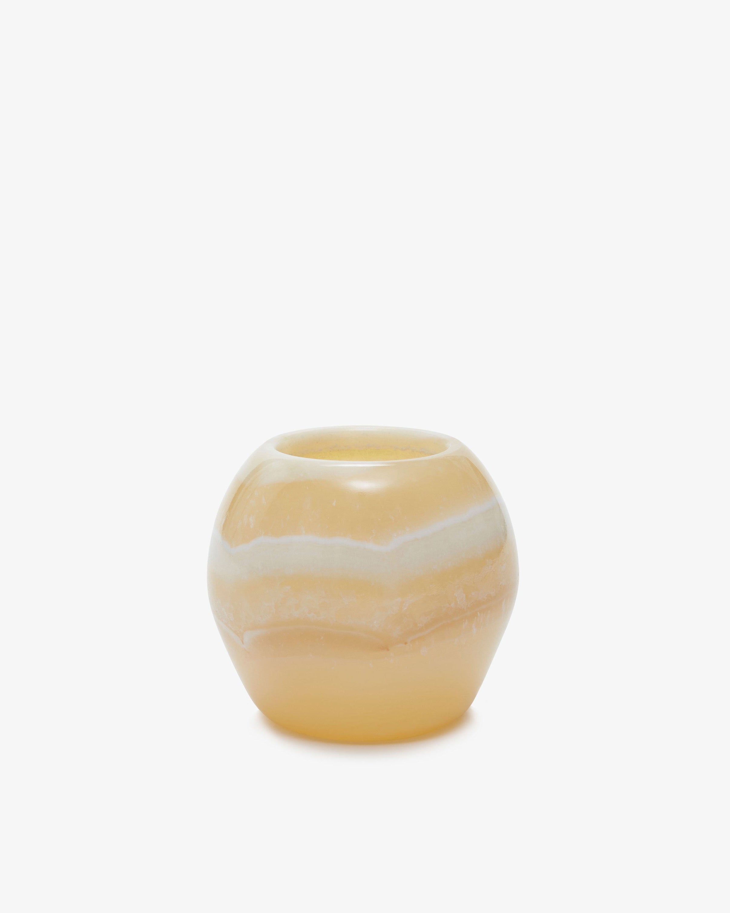 Akila Candle Holder. Semi-translucent white-yellow alabaster stone candle holder with a rounded shape. Extra small size.