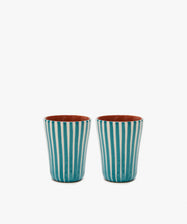 The Natalia Espresso Cup, Set of 2, features unique handmade ceramic cups with vertical turquoise and white stripes, displayed side by side on a plain white background.