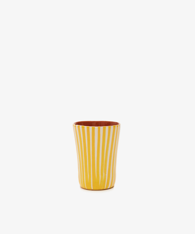 Single yellow and white striped glazed terracotta tumbler.