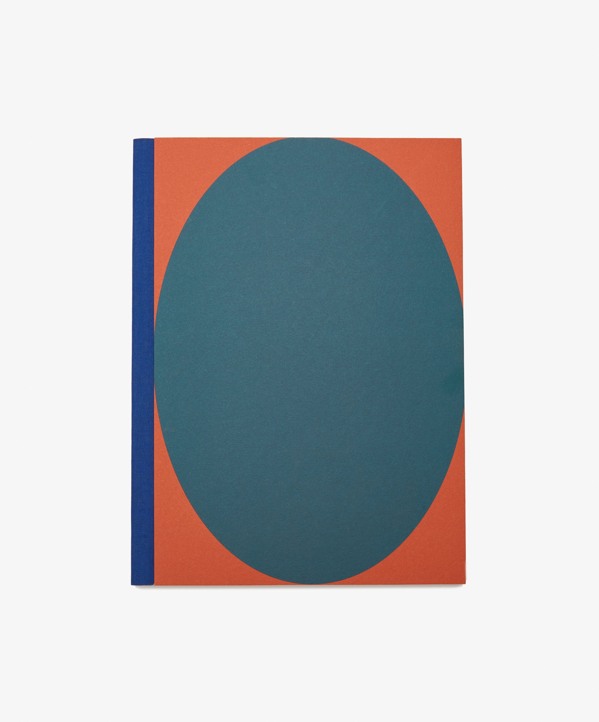 Dreamer's Notebook by Positional. Rectangular book with orange background, teal oval, and blue bound spine.