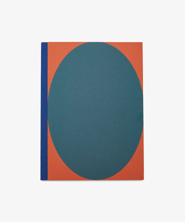Dreamer's Notebook by Positional. Rectangular book with orange background, teal oval, and blue bound spine.