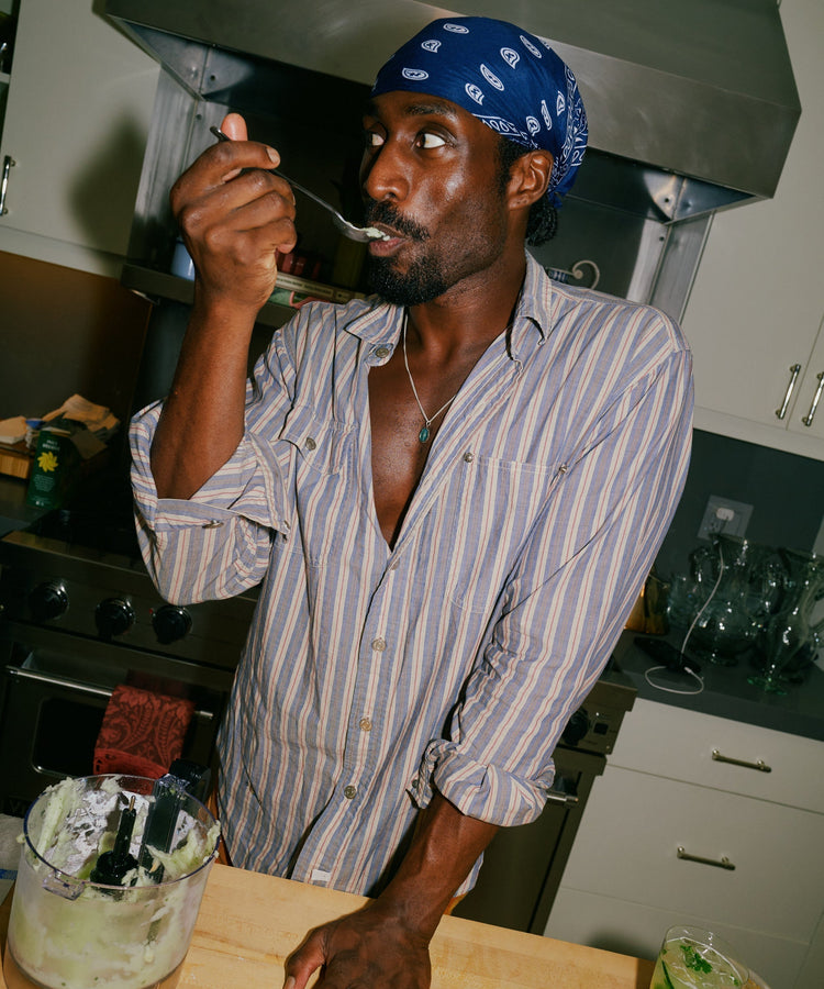 Chef in kitchen tasting his food
