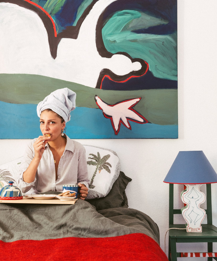 woman in bed eating breakfast