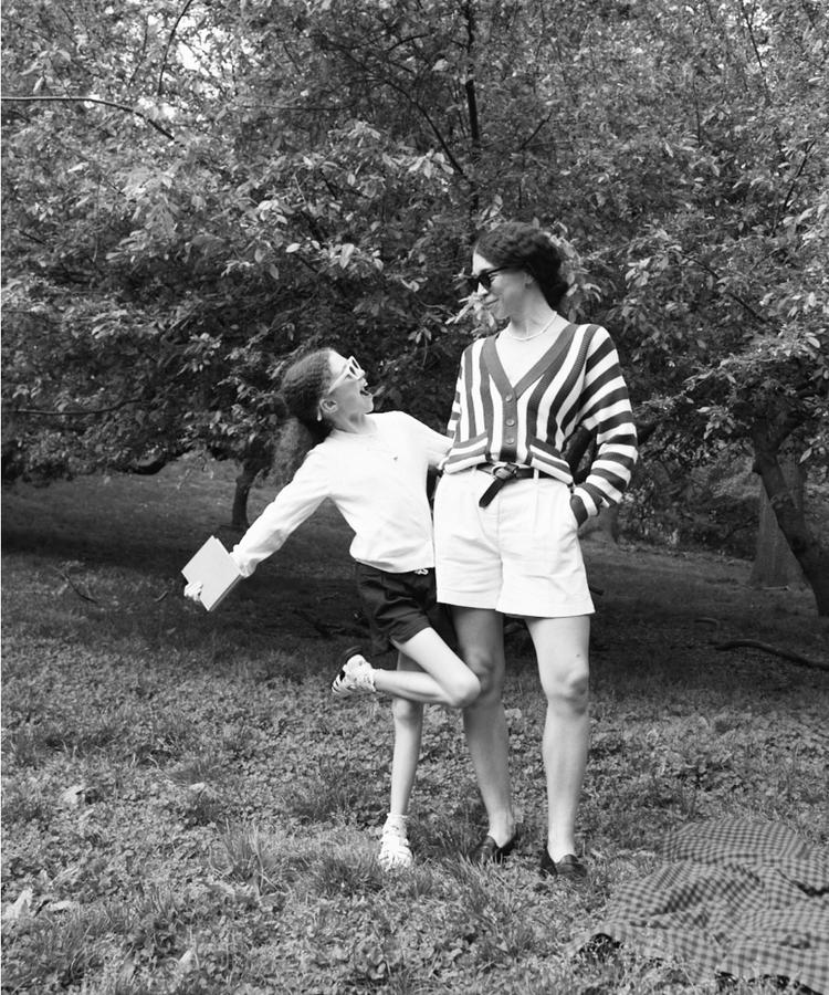 woman and teenager outside posing