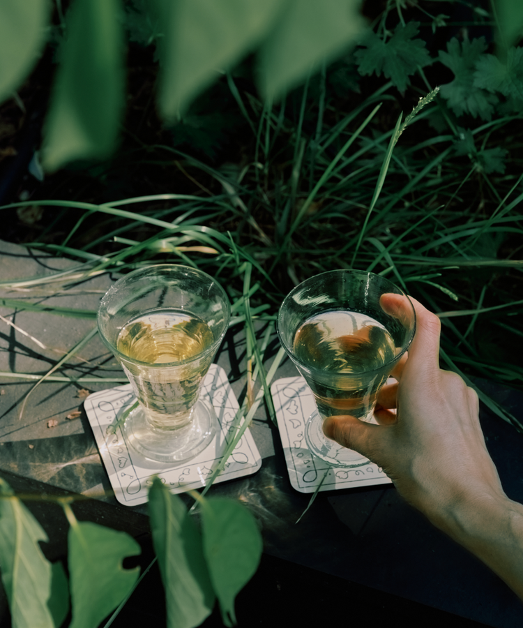 hand reaching for wine glass
