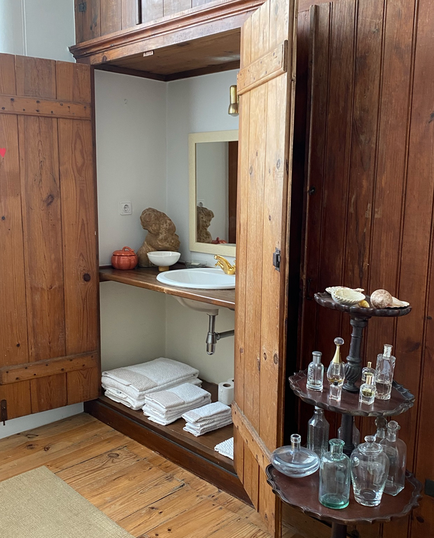 armoire with sink in it