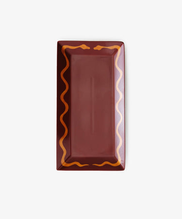 Hand Painted Double Serpent Tray by Matilde Argiolas. Rectangular porcelain tray in burgundy with ochre snake border.