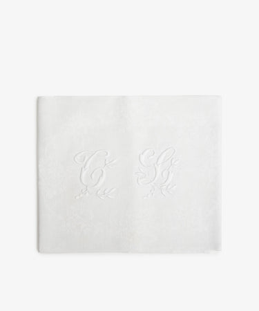 Vintage French Monogrammed Napkin. White damask napkin with embroidered initials and vine motif in white.