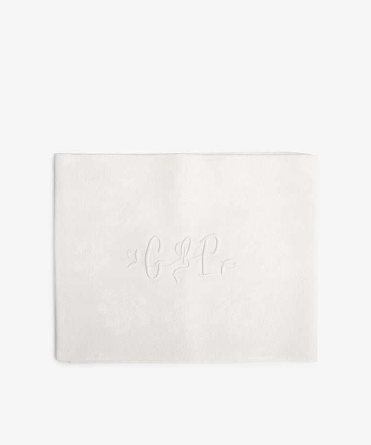 Vintage French Monogrammed Napkin. White damask napkin with embroidered initials in white.