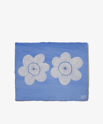 Two White Flowers by Nancy McKie is a botanical painting of two white, spiral-patterned flowers with blue centers on a blue background, signed NM. Featured in the Art360 exhibition.