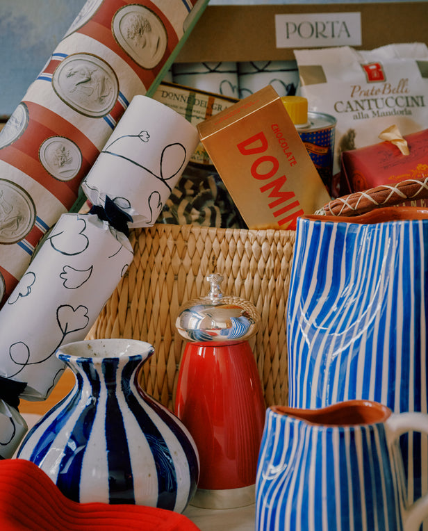 Assorted decorative items including vases, a can, and a box with visible branding.