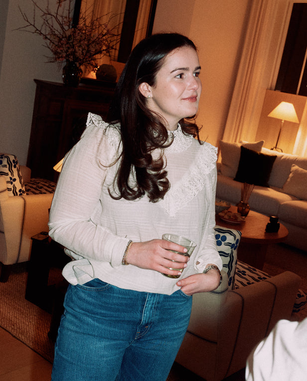 woman hold glass in room