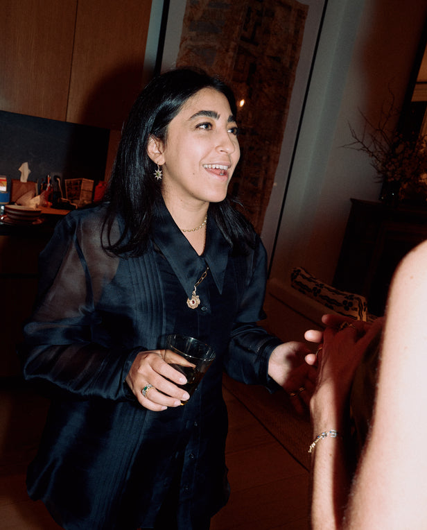 woman talking holding a drink