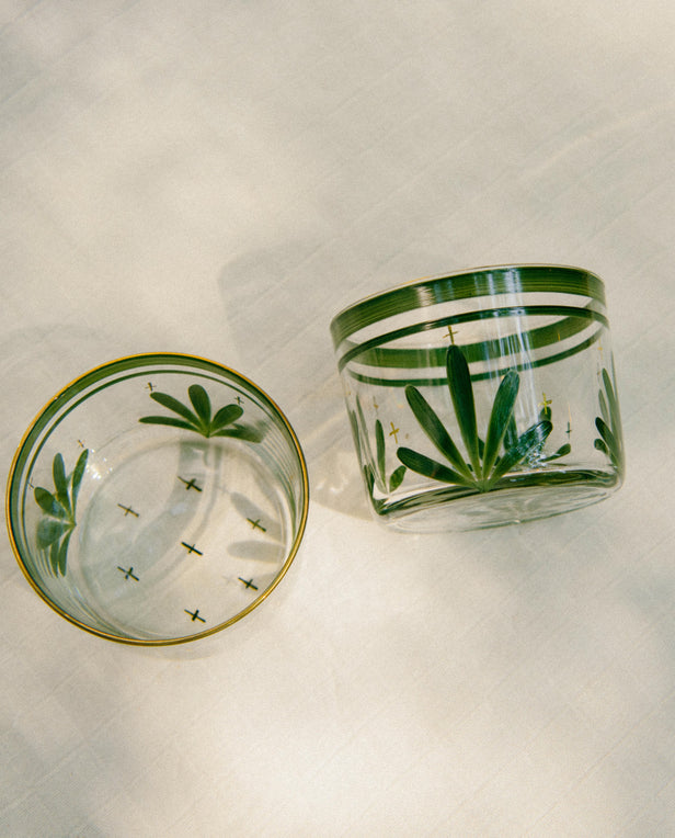 two glasses with green motif