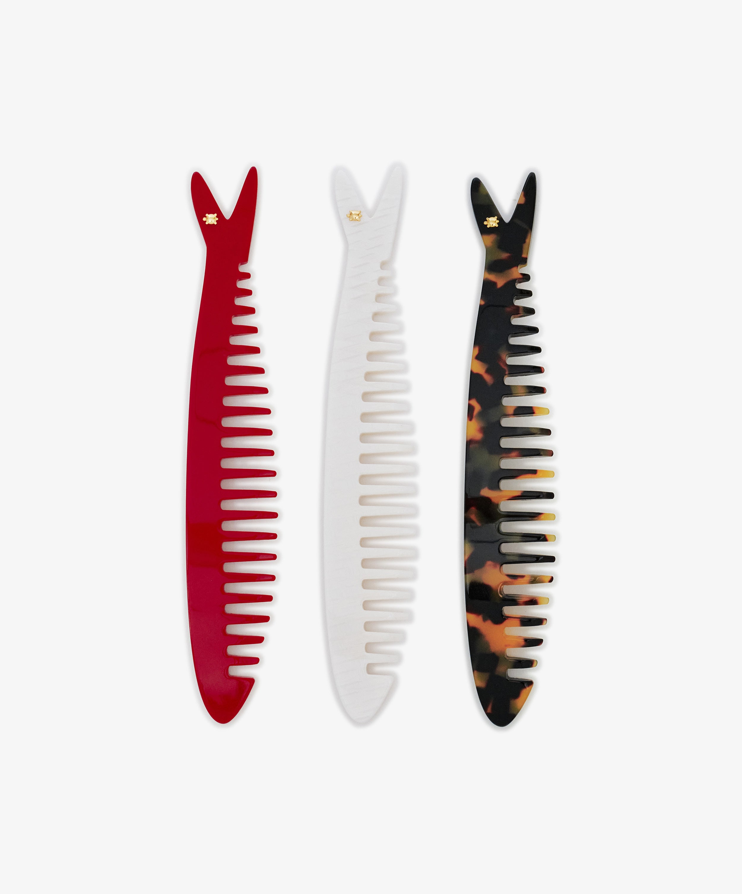 The Capri Sardine Comb set features three fishbone combs—in red, white, and classic tortoiseshell—arranged side by side on a white background, ideal as stylish hair detanglers for any hair type.