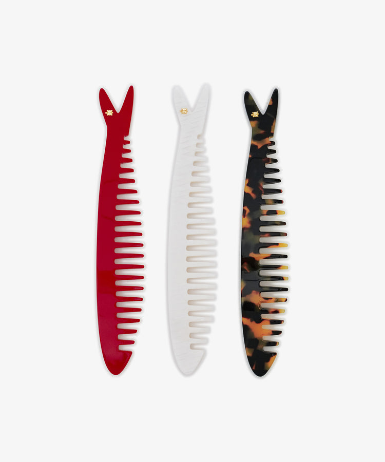 Three Capri Sardine Combs in red, white, and tortoiseshell are displayed side by side on a white background—perfect for detangling hair with style.