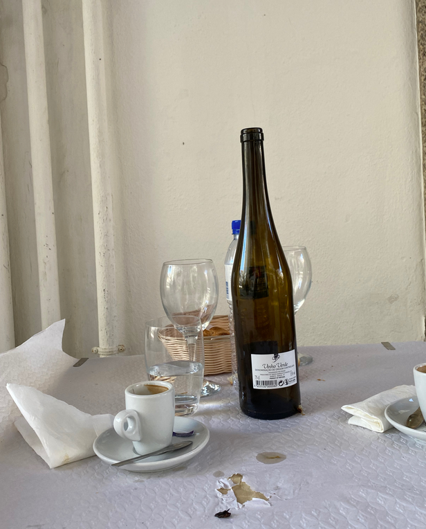 table with wine bottle and glassware