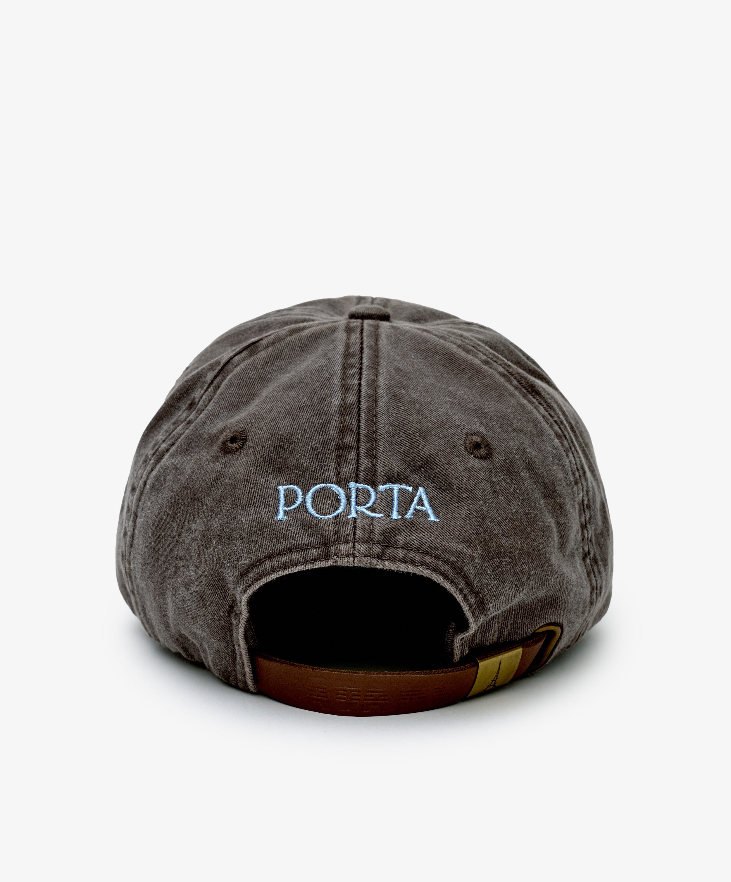 The Closed for August Cap is a dark gray baseball cap with light blue PORTA embroidery and an adjustable brown strap with a gold clasp—ideal for sun protection on your next European escape.