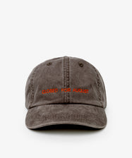 The Closed for August Cap—a gray baseball cap featuring “CLOSED FOR AUGUST” embroidered in orange—blends essential European out-of-office style with sun protection.